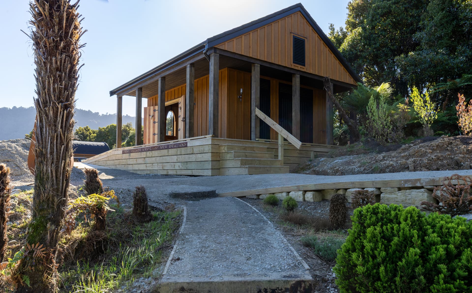 Timber lodge building with a covered veranda and Viking Village sign